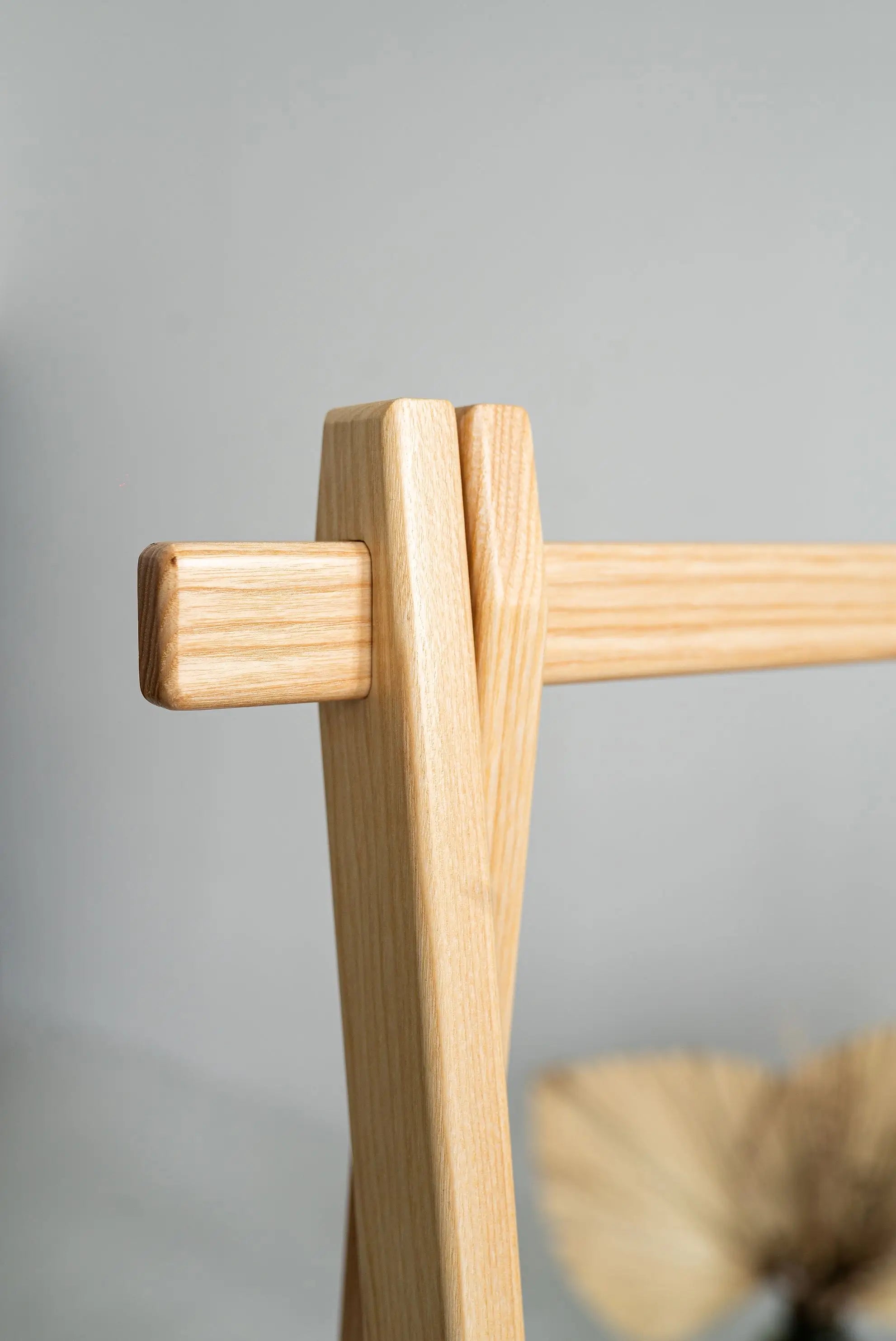 Sustainable wood garment rack – minimalist construction for boutique displays