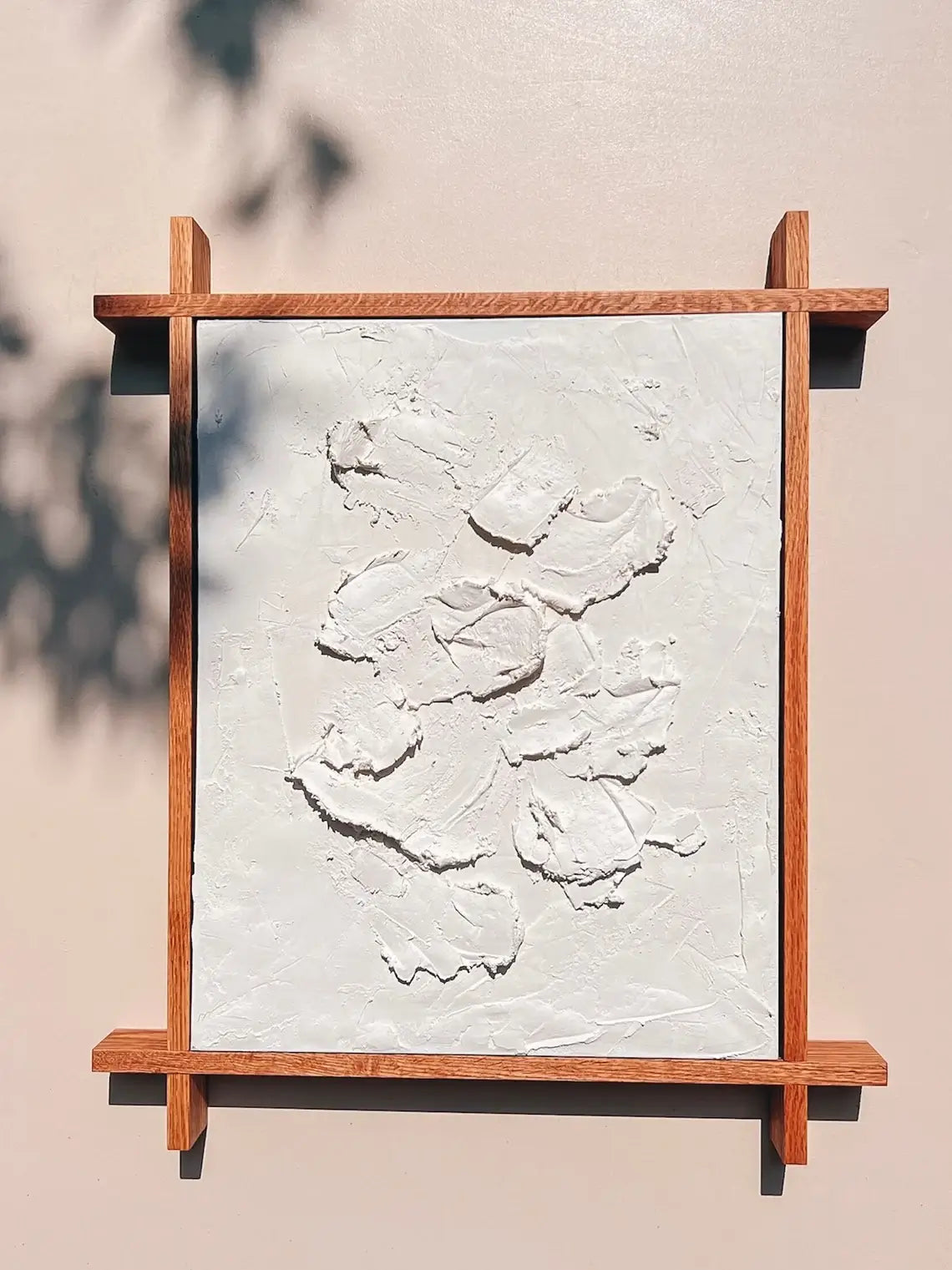 Custom handcrafted wooden frame holding stretched canvas painting