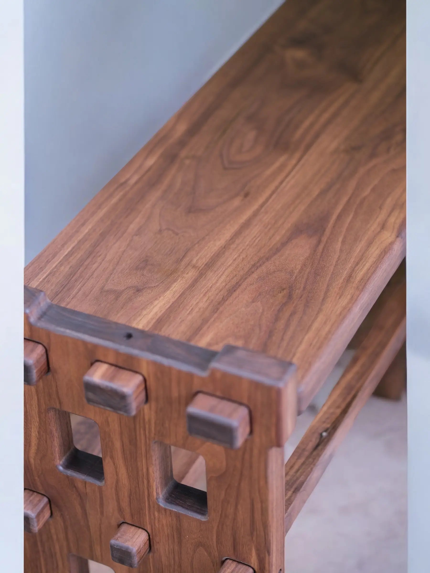 Modern walnut bench with clean lines and premium hardwood construction